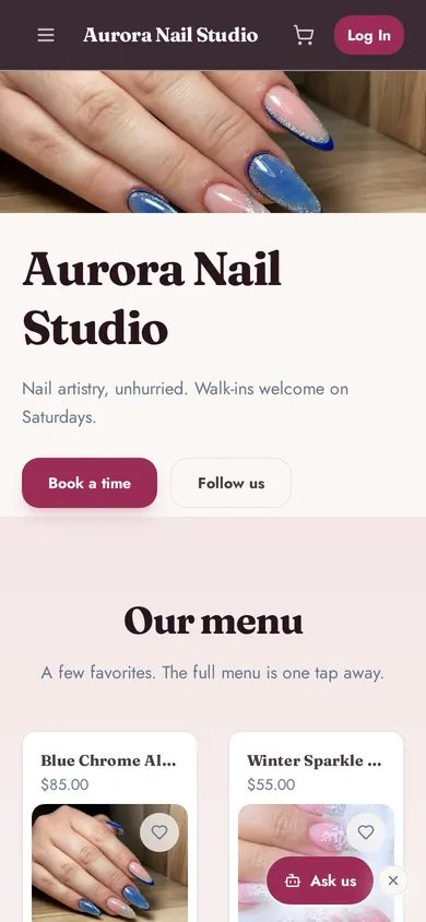 A nail studio’s booking page on a phone, with a nail art photo, a Book a time button and the first services on the menu.