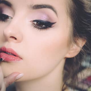 Liner being drawn along a client’s lash line