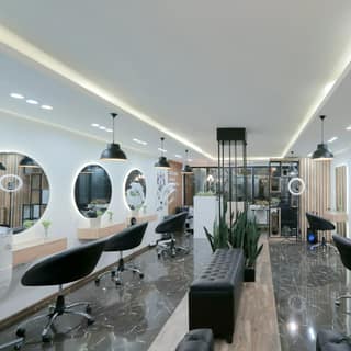 A bright salon floor lined with stations and mirrors